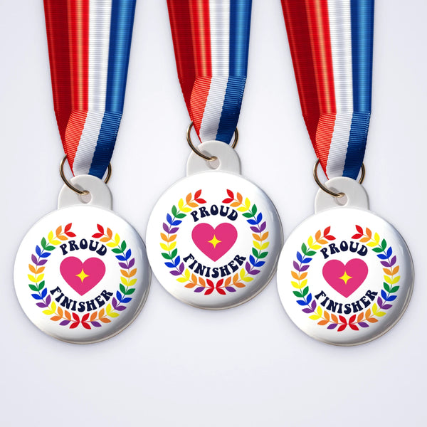Custom 58mm medals printed with a rainbow wreath, a heart and Proud Finisher on a striped ribbon