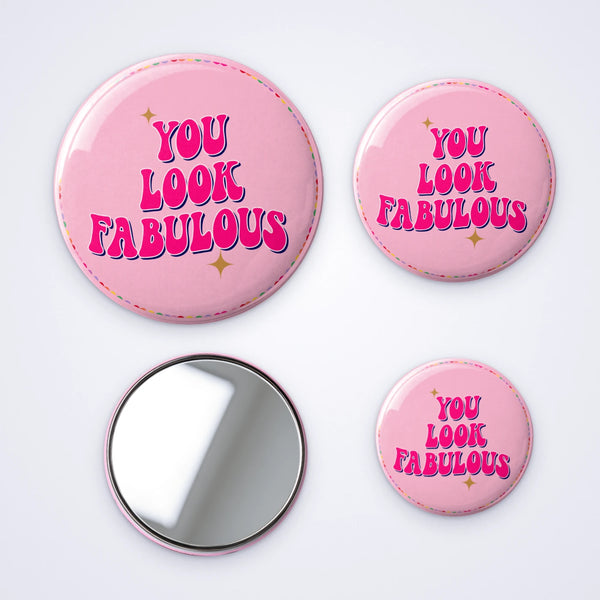 Custom pocket mirrors in three sizes printed with You Look Fabulous on pink with rainbow hearts, and the mirror back