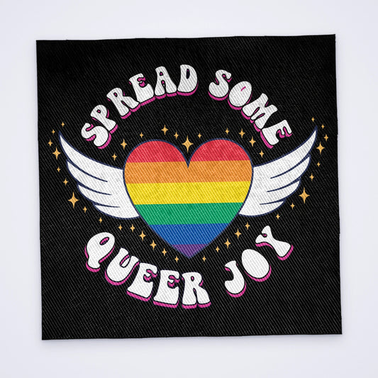 Custom sew-on back patch printed in full colour with a winged rainbow heart and the words Spread Some Queer Joy