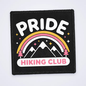 One custom sew-on patch with mountains, a rainbow and the words Pride Hiking Club